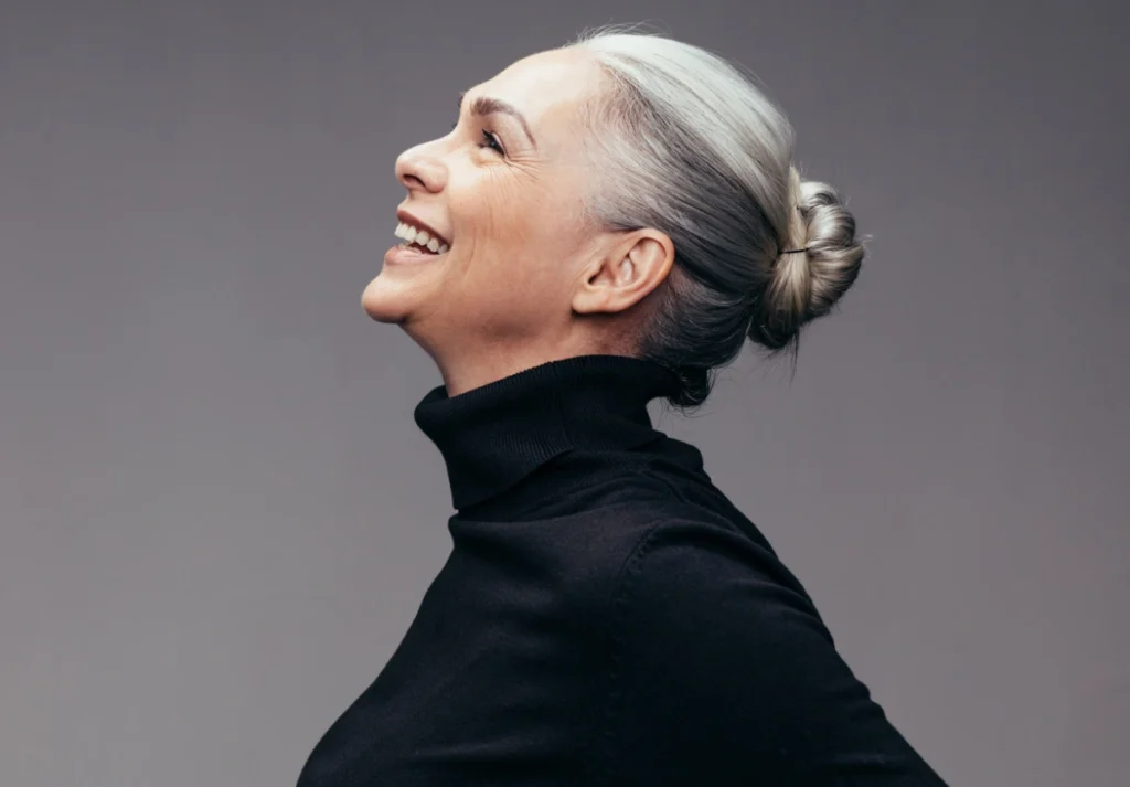 Mature woman smiling, profile in George, UT | MaVie Med Spa