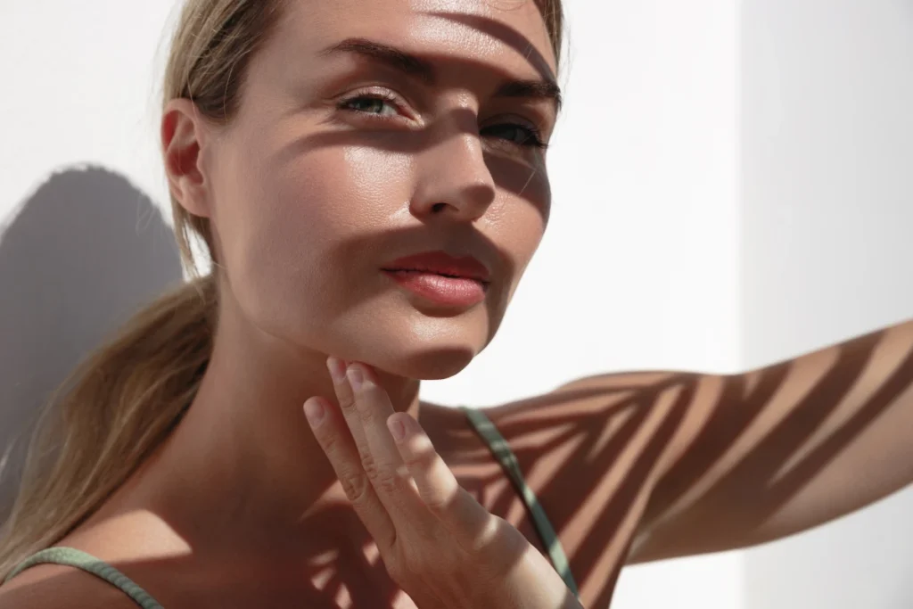 Beautiful woman with her hand on her face | MaVie Med Spa in George, UT