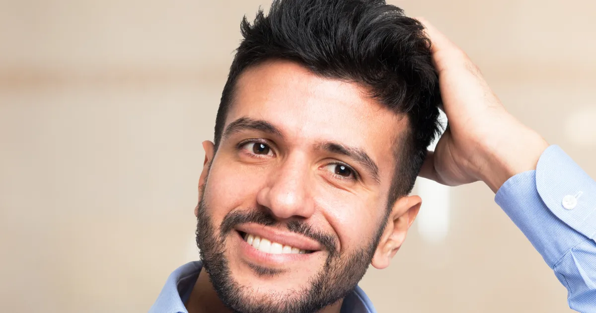 A smiling man representing successful hair restoration results for Alma TED treatment in St. George, UT.